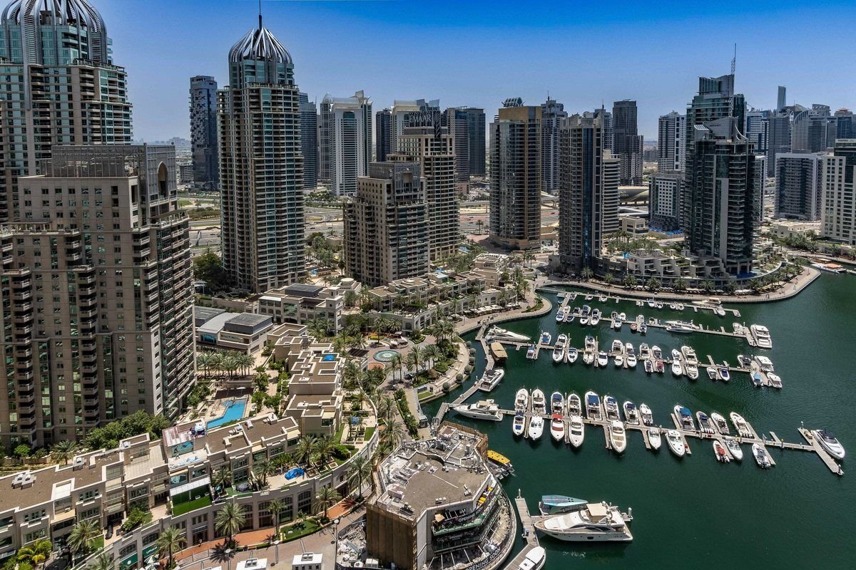 Aerial view of Dubai Marina towers and yachts, United Arab Emirates